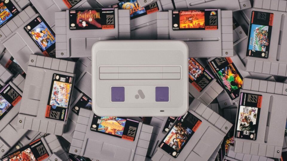 Analogue Super Nt sitting atop a bunch of SNES games